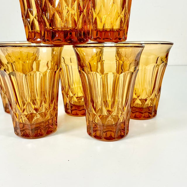 These are a set of 8 Depression Era Pressed Glass Tumblers from the Indiana Glass Company. They were produced during the...