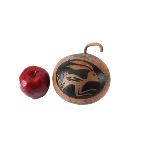 Rare hand-carved gourd artwork by Ridge Kunzel featuring a powerful Native American reinterpretation of the classic...