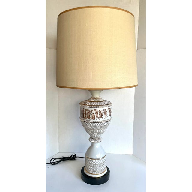 Here is an exquisite pair of Fiorentine lamps made in Italy in the mid-century. The lamps feature an incredible...