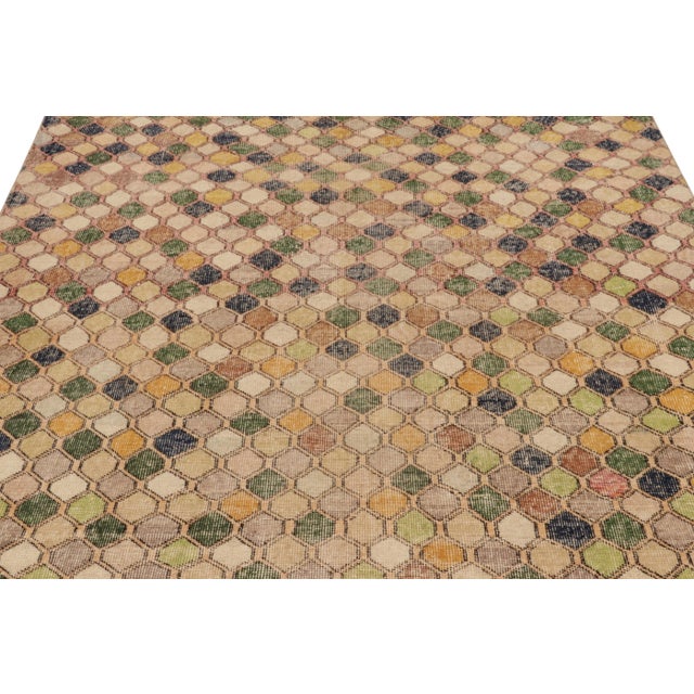 This vintage rug is a 6x8 Turkish distressed piece, made with hand-knotted wool circa mid-20th century. It is an exciting...