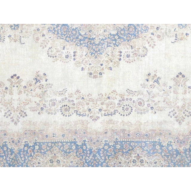 1940s Persian Kerman Carpet. Hand woven in the Kerman region of Iran. Distressed and refinished in the U.S. The Persian...