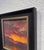 The painting captures a dramatic sunset, with deep purples and fiery oranges blending seamlessly in the sky. The...