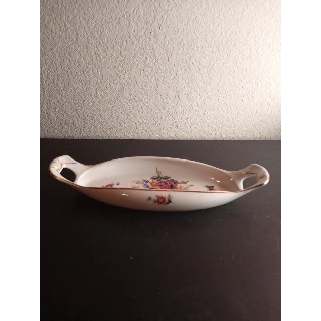 This is a vintage Fine Porcelain Handpainted Floral Moriage 11" Vanity Tray Procured at auction
