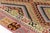 This is a vintage Turkish Oushak rug from the Mid 20th Century. The piece was hand-knotted.