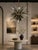 Dramatic and sculptural California "Sunburst" chandelier by Remains Lighting, crafted in solid brass with contrasting...