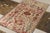 Handknotted in a fine blend of wool and silk, this 5x9 modern rug draws inspiration from traditional Agra...