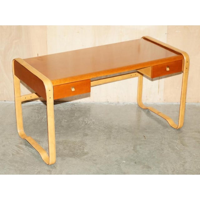 Italy Leather strapped and Maple writing table or desk. Desk dimensions Height:- 76cm Width:- 143.5cm Depth:- 70cm Legroom...