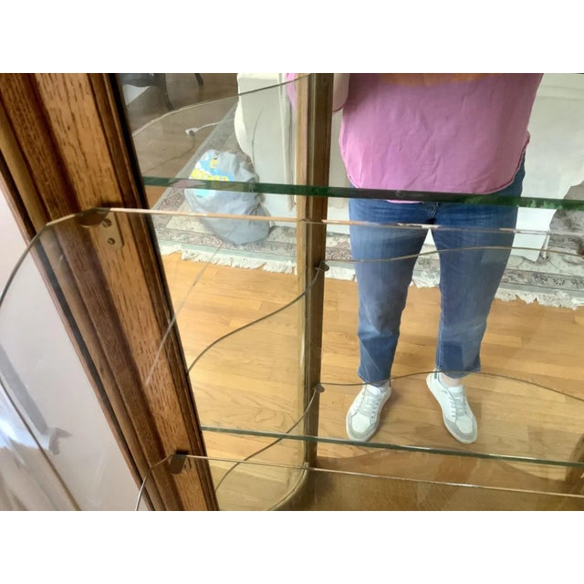 Early 20th Century Victorian Carved Oak Bow-Front Lighted Curio China Display Cabinet For Sale In New York - Image 6 of 11