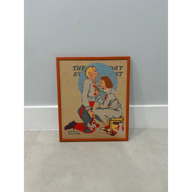 A charming vintage hand-stitched needlepoint depicting Norman Rockwell’s iconic September 1937 Saturday Evening Post...