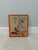 A charming vintage hand-stitched needlepoint depicting Norman Rockwell’s iconic September 1937 Saturday Evening Post...