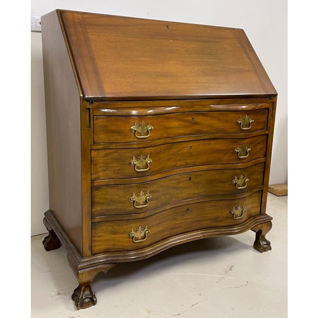 1940's secretary desk with drop leaf feature - plenty of organizational space Original finish and brass hardware H: 42" D:...