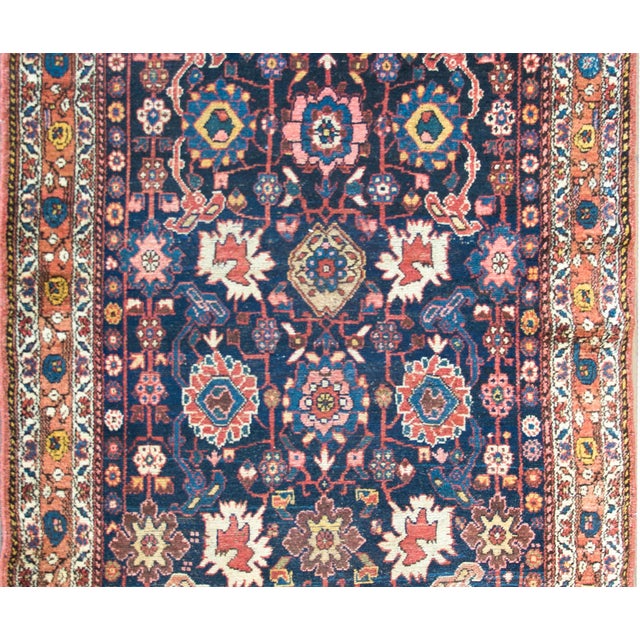 A stunning late 19th century Persian Kurdish rug with the most beautiful all-over large-scale mirrored floral pattern...