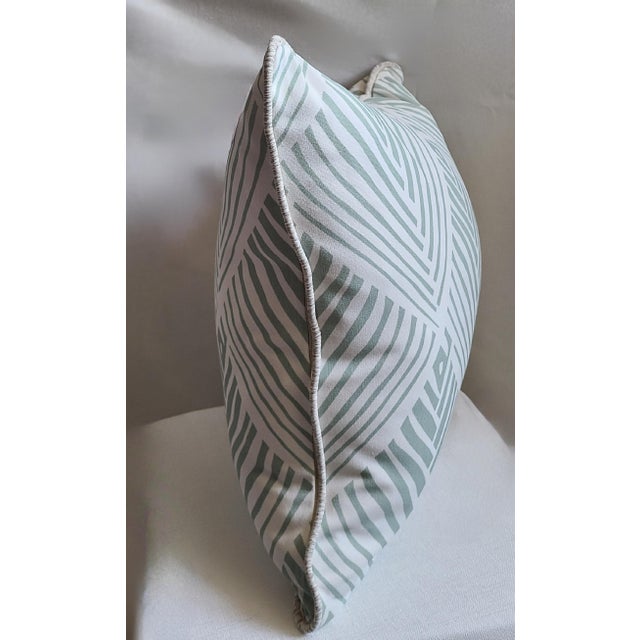 18x18 pillow in indoor/outdoor Serena Dugan fabric with applied cord from Samuel & Sons Passementerie. Insert is a William...