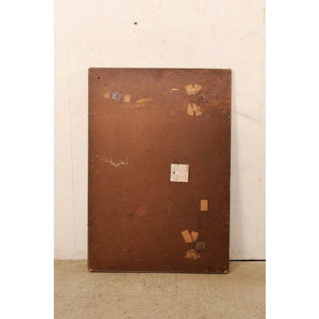 A vintage American larger-sized mirror within a clear glass frame. This rectangular shaped mirror stands just shy of five...