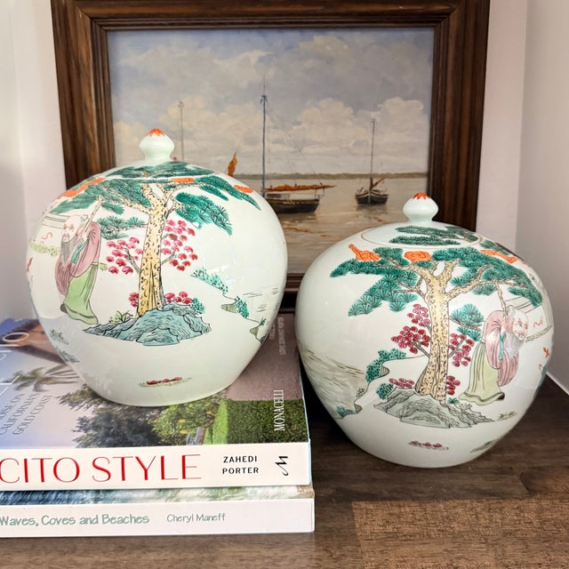 A beautiful pair of vintage Chinese porcelain melon jars featuring hand-painted figural scenes in the Famille Rose...