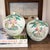 A beautiful pair of vintage Chinese porcelain melon jars featuring hand-painted figural scenes in the Famille Rose...
