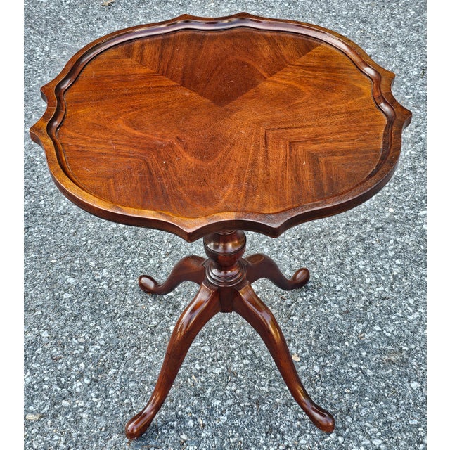 George III Mahogany Bookmatched Pedestal Quad snake feet Tea Table. Measures 24" in with, 24" in depth and 25.5"