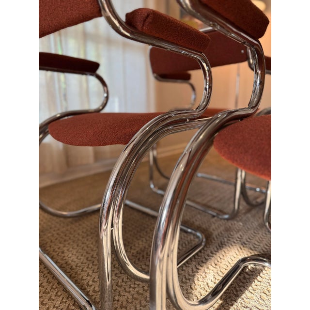This set of 4 chrome chairs is absolutely gorgeous. Freshly reupholstered in a rich rusty red boucle, they bring a luxe,...
