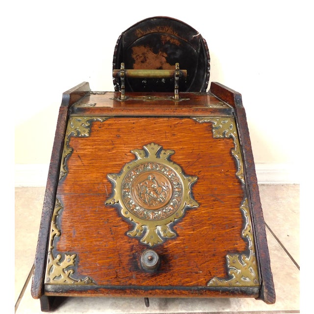 Wonderful antique 19th century wood and brass figural scuttle box coal bucket on wheels with liner and copper scoop. Circa...