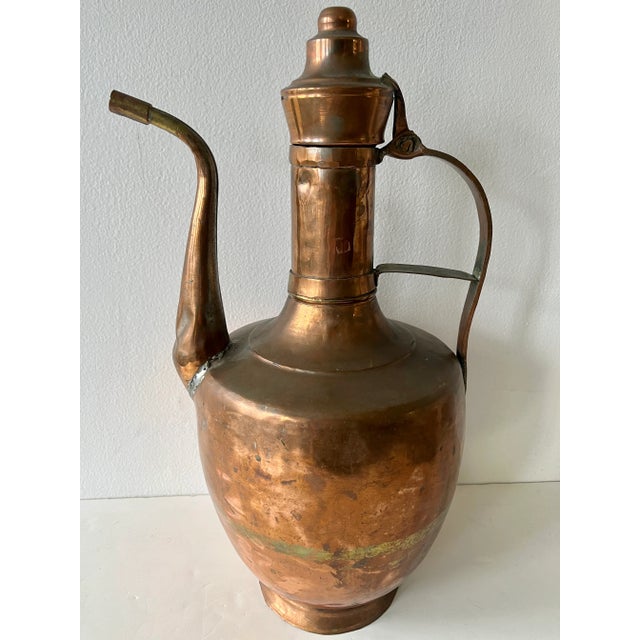 A 19th century large-scale solid copper ewer with hinged lid, made in French/Spanish style. Origin unknown.