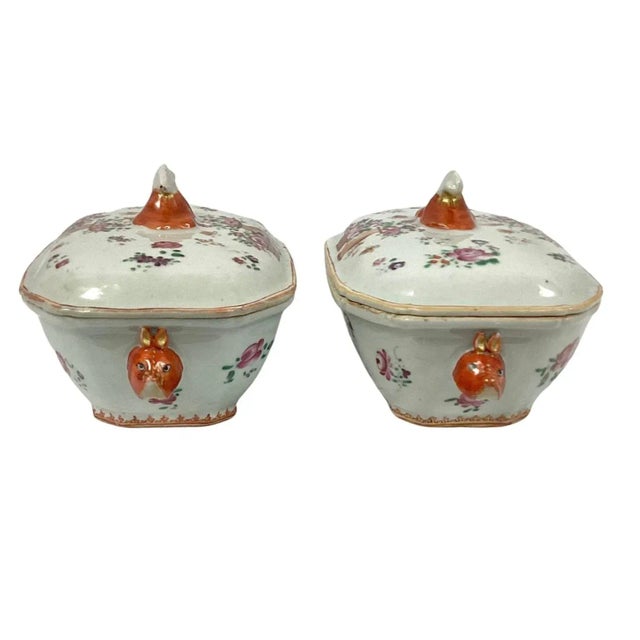Set of two small Chinese export famille rose porcelain tureens. Colors of pink, orange, and brown on a white background....