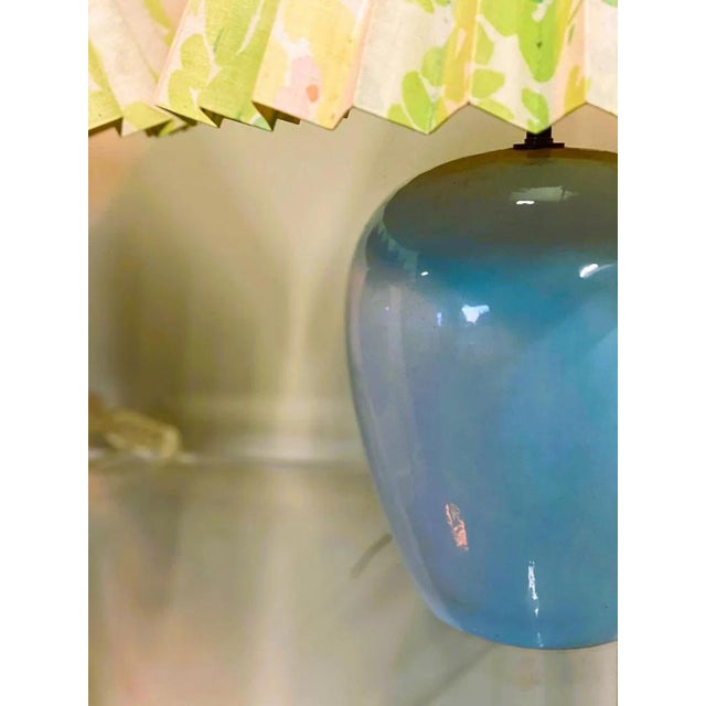 Lovely pair of Vintage table lamps in a lovely baby blue color. The shade are a kind of linen/canvas fabric on cardboard...