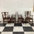 Elegant set of four vintage Chippendale-style dining armchairs featuring beautifully carved pierced splats with shell...