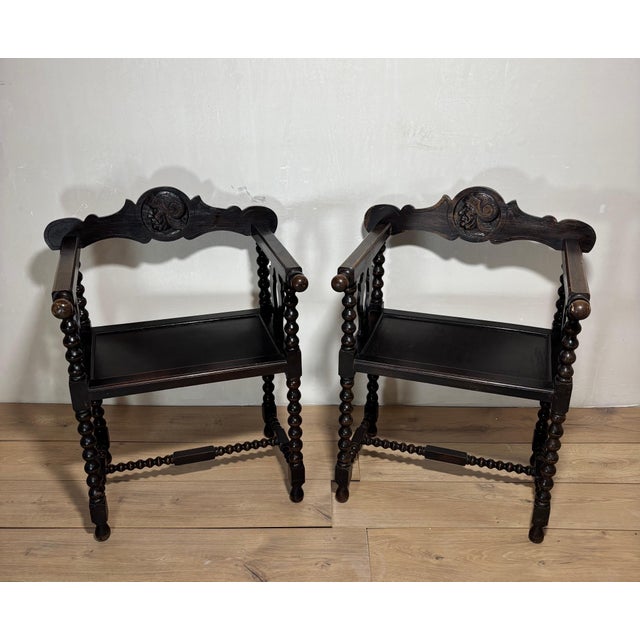 Striking pair of Spanish armchairs crafted in solid wood, featuring beautifully turned barley twist legs and stretchers, a...