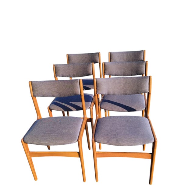 Set of six Mid-Century Scandinavian dining chairs with teak frames and upholstered seats and backs. Solid wood...