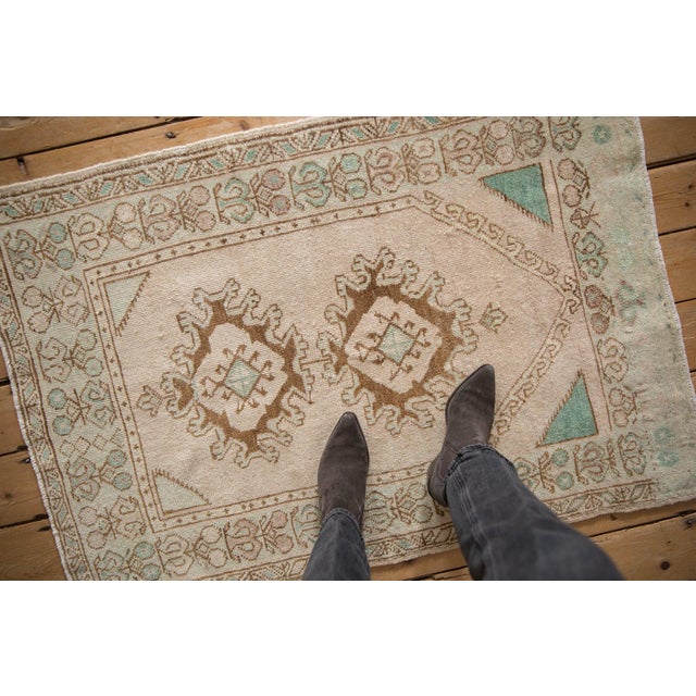 :: Double center medallion with interior geometric gul in a diamond shaped format and hook and latch motif. Partial prayer...