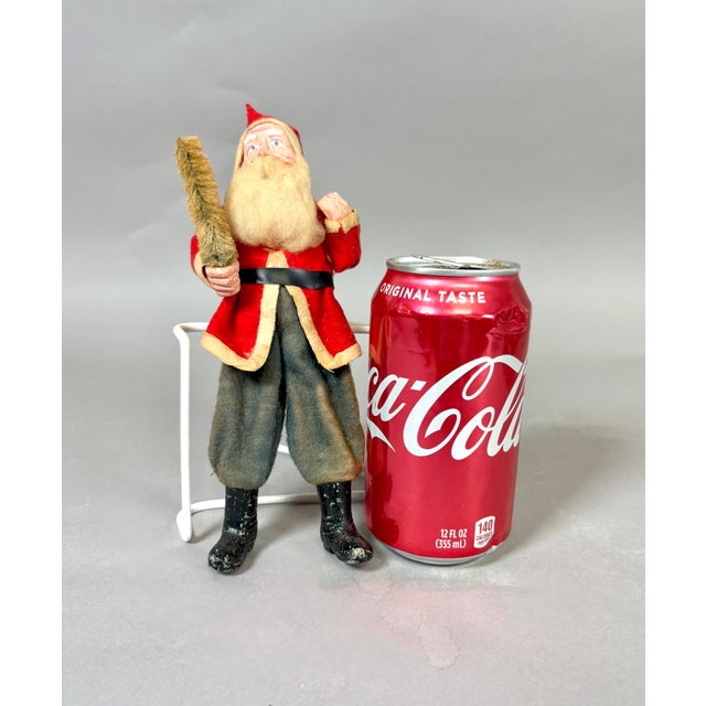 Antique Japanese Santa Claus figure, circa 1930s, with a hand-painted composition face and hands, woolly cotton beard, red...