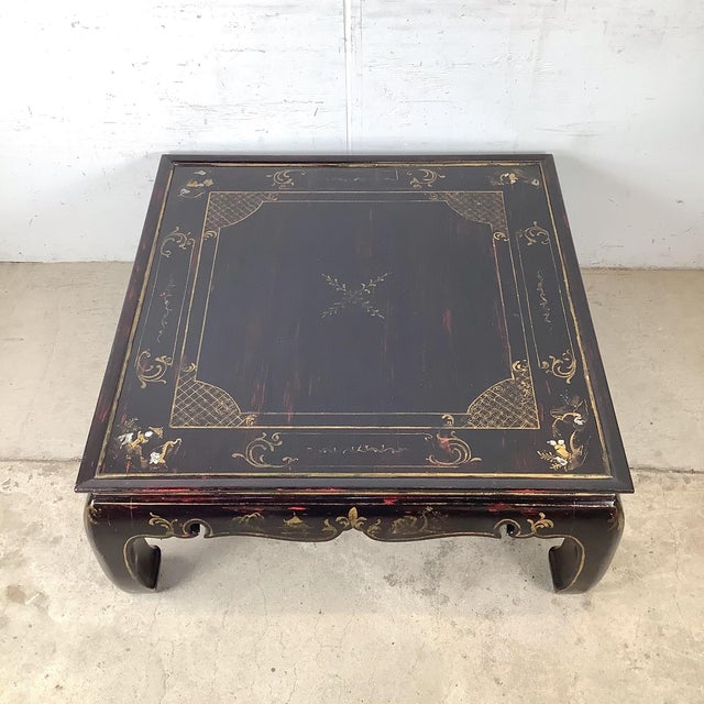 This vintage black lacquer cocktail table embodies the layered elegance of chinoiserie revival design. Its low, sculptural...