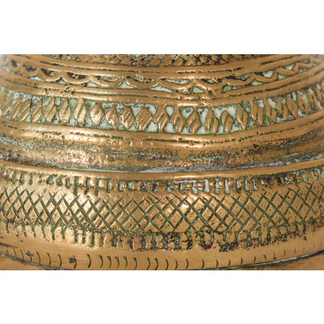 This one-of-a-kind african brass pot is adorned with multiple layers of geometric patterns give a highly stylish and...