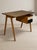 A distinctive mid-century writing desk designed by British designer Robin Day in the 1950s. Robin Day developed an...