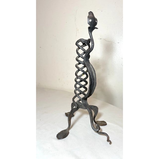 Up for sale is a wonderful antique handmade wrought iron figural candlestick. It's completely wrought by hand with...