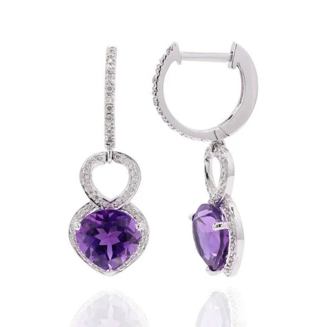 This is part of Chairish’s Fine Jewelry assortment. Earrings create a beauty while showcasing the colors of the natural...