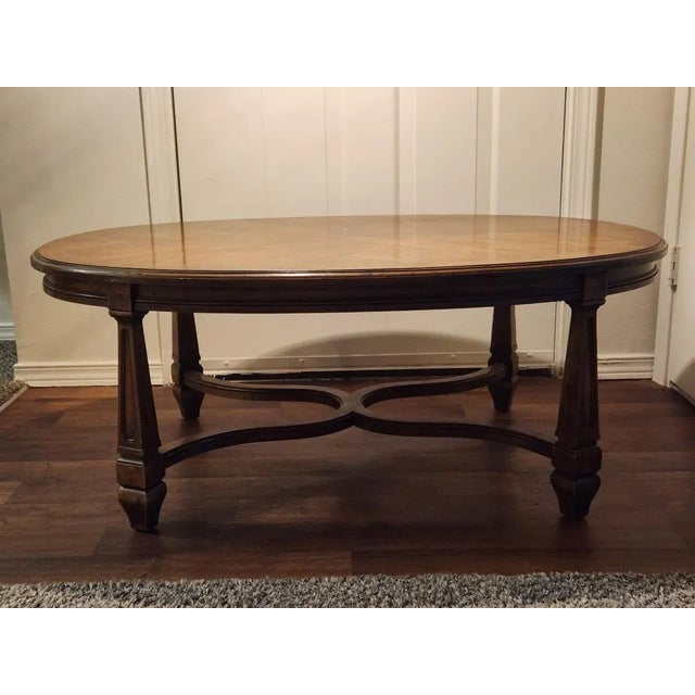 This is a beautiful vintage oval coffee table made by Heritage Furniture, a respected American maker later associated with...