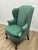 Elegant pair of Hickory Chair wingback lounge chairs featuring a classic Chippendale-inspired silhouette with beautifully...