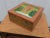Enhance your home decor with this stunning hand-painted wooden jewelry storage box, featuring a beautiful Indian theme....