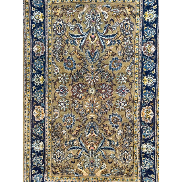 A mid 20th-century masterpiece – a Kashan rug, meticulously handwoven with a blend of wool and delicate silk accents on a...