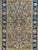 A mid 20th-century masterpiece – a Kashan rug, meticulously handwoven with a blend of wool and delicate silk accents on a...