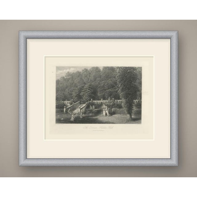 The garden terraces of Haddon Hall, seen from the lawn below. A long stone balustrade topped with ball finials runs across...