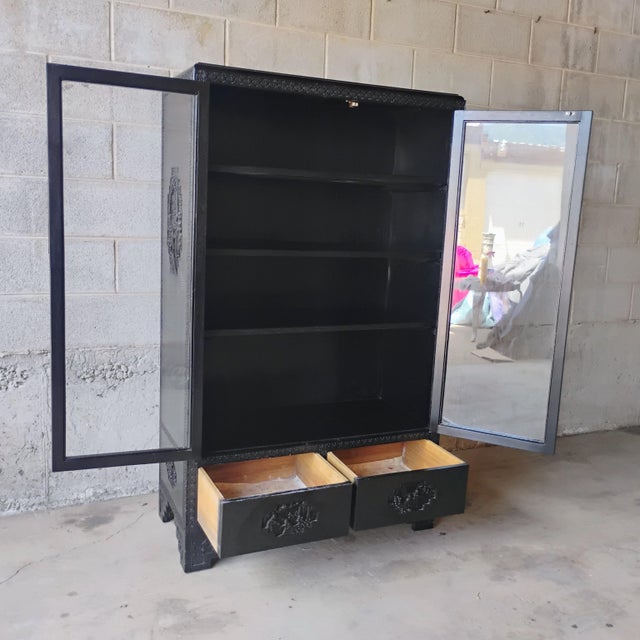 Add elegance and functionality to any space with this antique Chinese display cabinet. Features include intricate...