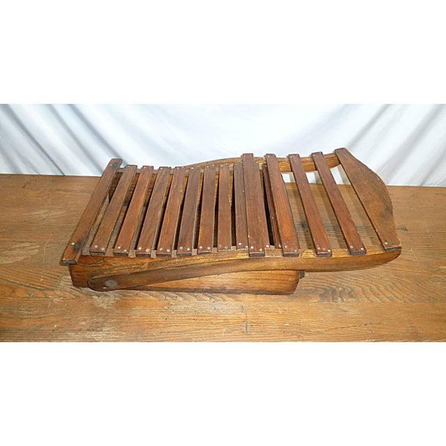 Antique folding oak canoe or camp chair found in Maine dating to approximately 1900-1930. This lightweight slatted folding...