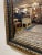 A beautiful rectangular mirror with a gently curved top. Features a parcel and giltwood , nicely detailed frame. In very...