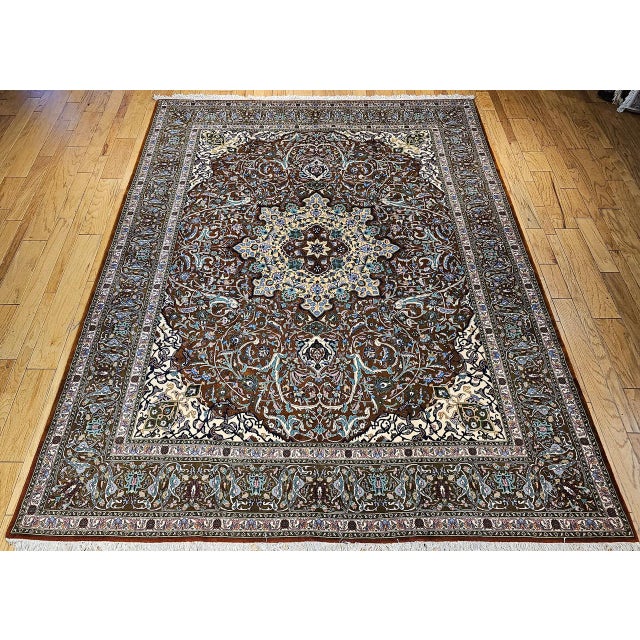 "An exquisite vintage Persian Tabriz rug from the first quarter of the 20th century, featuring an intricate floral pattern...