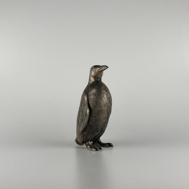 Entirely worked in metal with a silver-plated finish over what appears to be solid brass, this remarkable object is a...