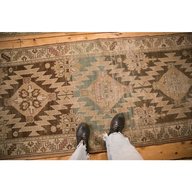 :: Concentric diamond shaped center medallions with lighting serrated contour interconnected by minor vines atop a covered...