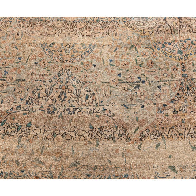 A late 19th century Persian Kirman (Kerman) antique carpet, having a blue and beige allover lozenge lattice of cusped...