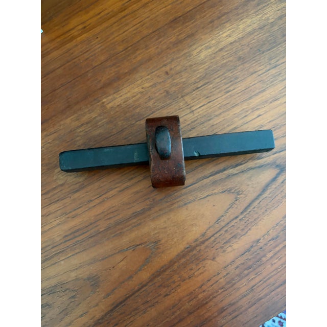 A finely crafted 19th-century English marking gauge handcrafted from richly figured rosewood and retaining its original...